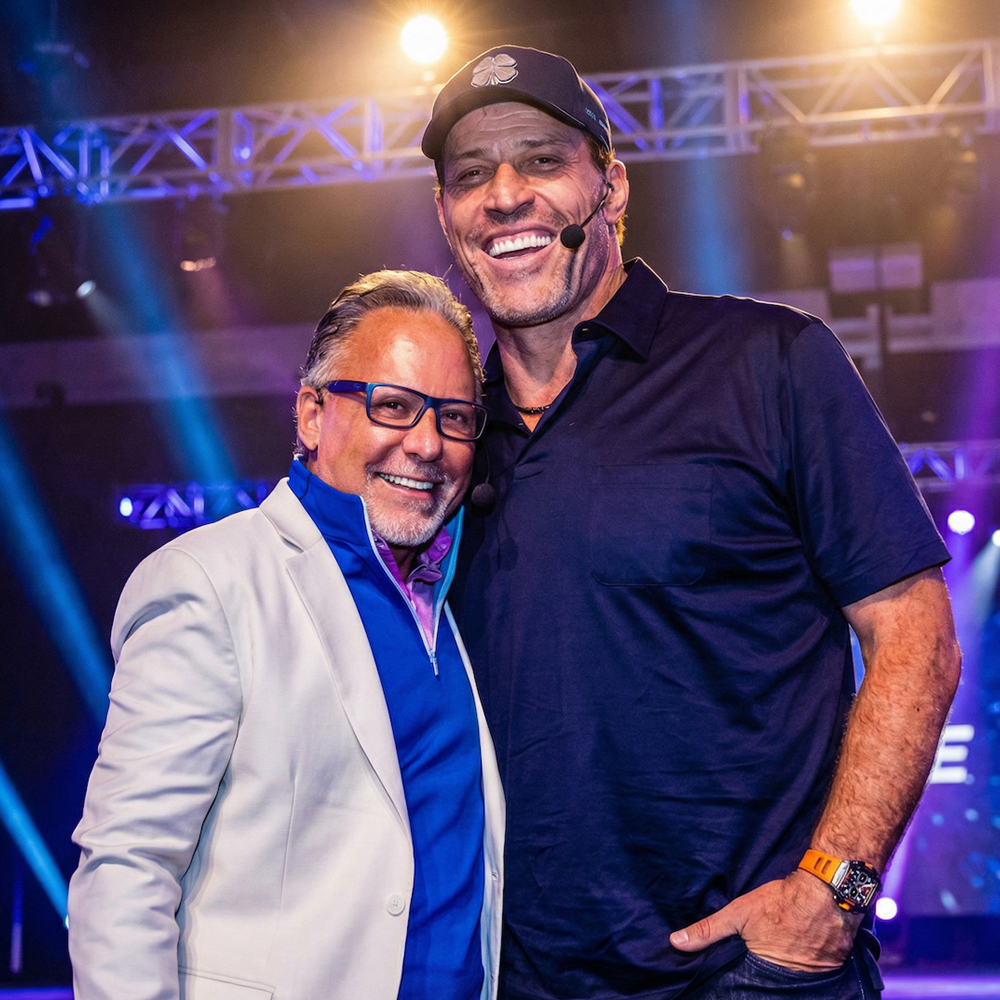 Jay Abraham with Tony Robbins on stage
